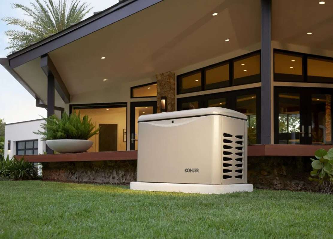 A Kohler standby generator installed beside a modern home