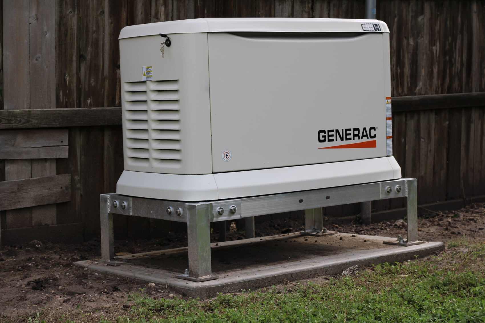 A Generac air-cooled standby generator installed by Critical Power Solutions on an elevated platform